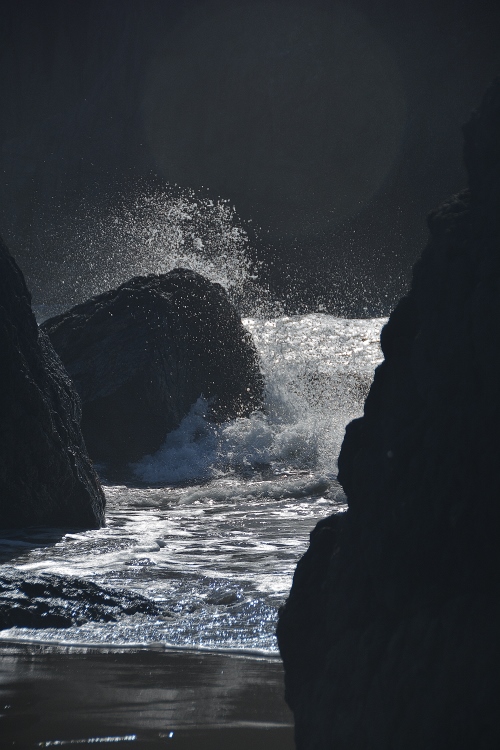 waves crashing between rocks